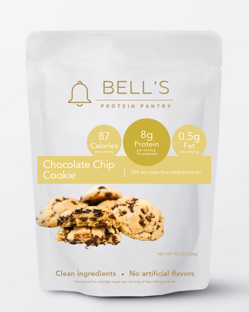 A stand-up pouch of Bell's Protein Pantry Chocolate Chip Cookie protein powder. The white packaging features gold and yellow accents, displaying nutritional facts (87 calories, 8g protein, 0.
